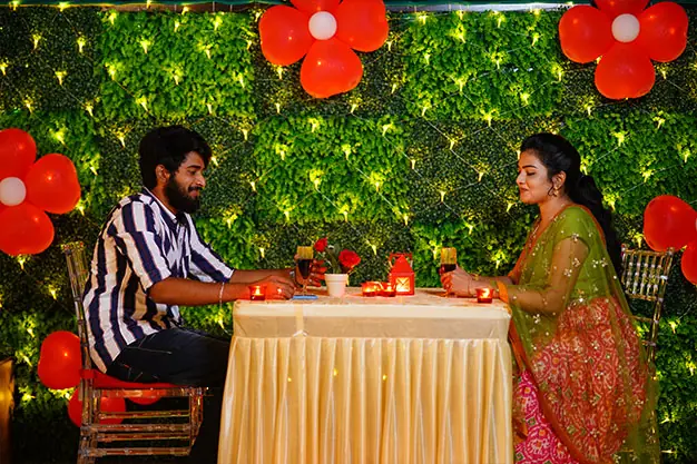 Candlelight dinner table setup at JD Sky Dine rooftop, Rajahmundry