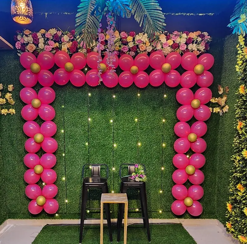 Pink floral balloon arch backdrop at JD Party Box